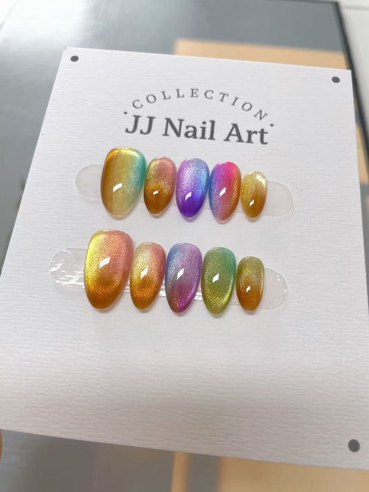 Set of colorful nail art samples on a 'JJ Nail Art' display card.