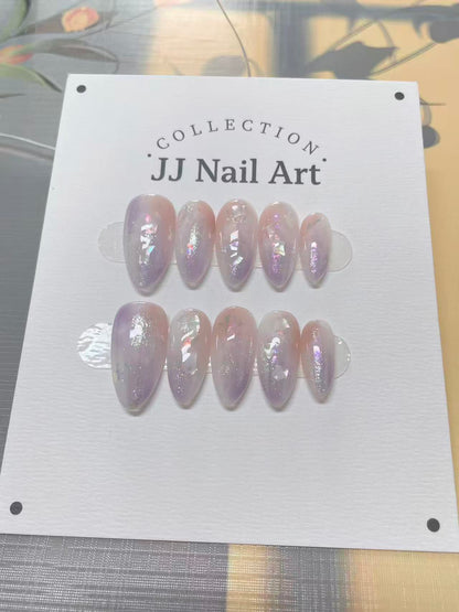 JJ Nail Art nail extensions on a display card with a floral background.