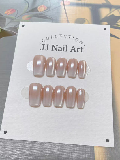 Set ofJJ Nail Art nail extensions on a white card with floral background