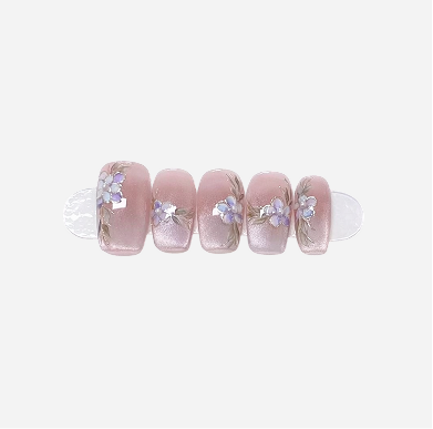 Set of pink nail wraps with floral designs on a white background