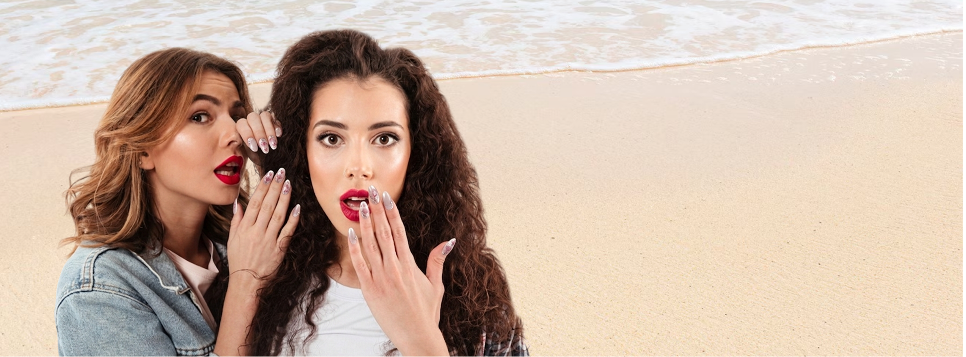 Two women applying makeup on a beach setting