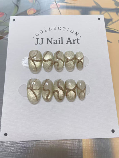 JJ Nail Art nail art collection on a white card with a patterned background